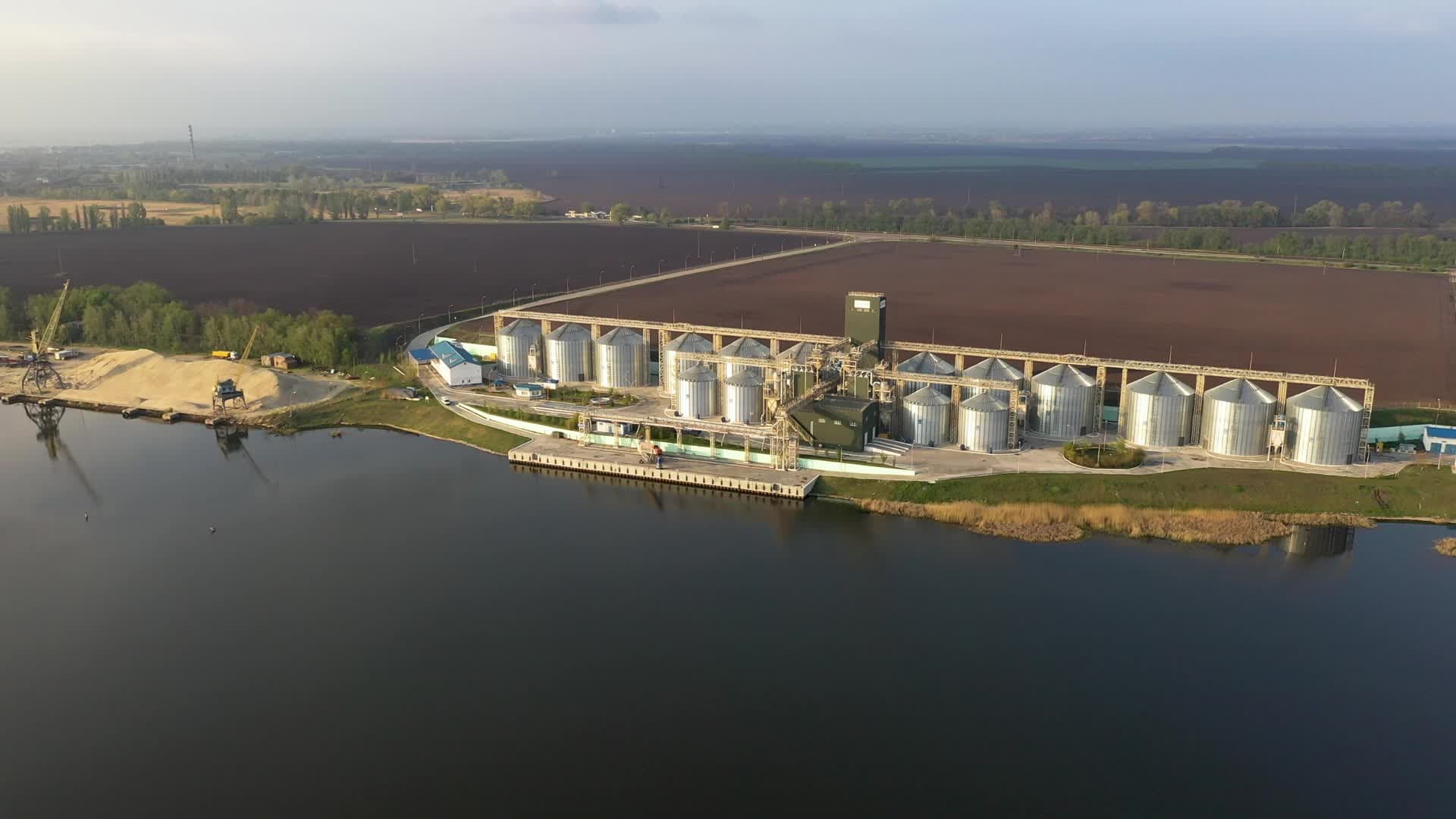 Image of the sky with silos in the background.